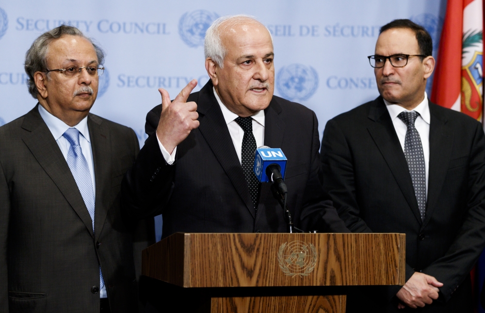 Riyad Mansour (C), Palestine's Ambassador to the United Nations, stands with Abdallah Yahya Al-Mouallimi (L), Saudi Arabia's Ambassador to the UN, and Mansour Al-Otaibi (R), Kuwait's Ambassador to the UN, following an United Nations Security Council meeting at United Nations headquarters in New York. — EPA