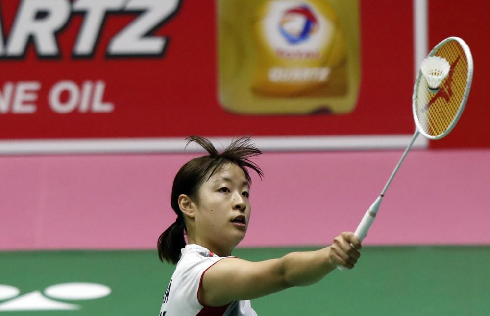 Nozomi Okuhara of Japan in action against Louisa Ma of Australia during their Uber Cup Group A badminton match at the Thomas and Uber Cup 2018 in Bangkok, Thailand, Sunday. — EPA