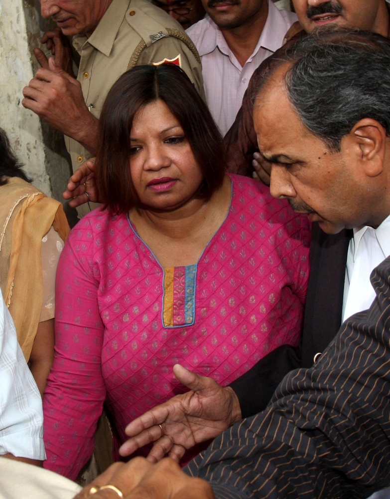Indian Foreign Service (IFS) officer Madhuri Gupta, center, is escorted after making an appearance at the Tis Hazari Court in New Delhi in this May 1, 2010 file photo. — AFP