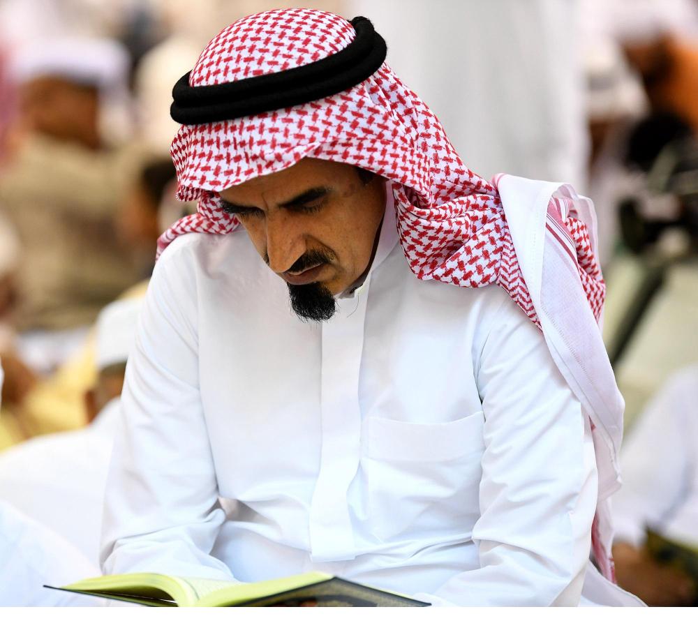 Engrossed in reading the Holy Qur’an