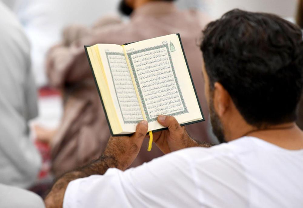 Engrossed in reading the Holy Qur’an