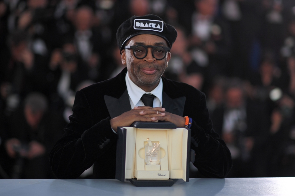 US director Spike Lee poses with his trophy after he won the Grand Prix for the film 