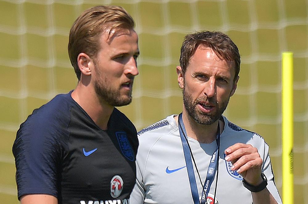 England’s manager Gareth Southgate (R) talks with England’s captain Harry Kane during a training session at St George’s Park in Burton-on-Trent Tuesday. — AFP