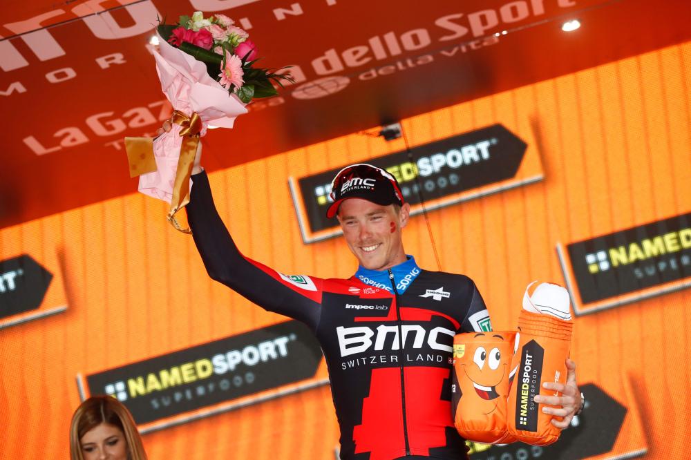 Australia's rider of team BMC Rohan Dennis celebrates on the podium after winning the 16th stage, a time trial between Trento and Rovereto, during the 101st Giro d'Italia, Tour of Italy cycling race, on May 22, 2018.   / AFP / Luk Benies