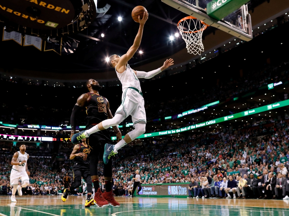 Boston Celtics forward Jayson Tatum (0) attempts a layup in front of Cleveland Cavaliers forward LeBron James (23) during the third quarter of game five of the Eastern conference finals of the 2018 NBA Playoffs at TD Garden. — Reuters