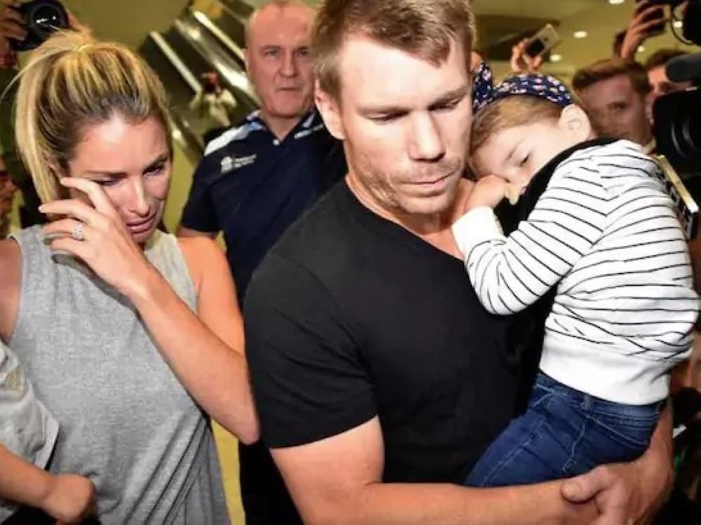 David Warner and his wife Candice, seen in this file photo, after returning to Australia from South Africa following the ball-tampering incident. — AFP