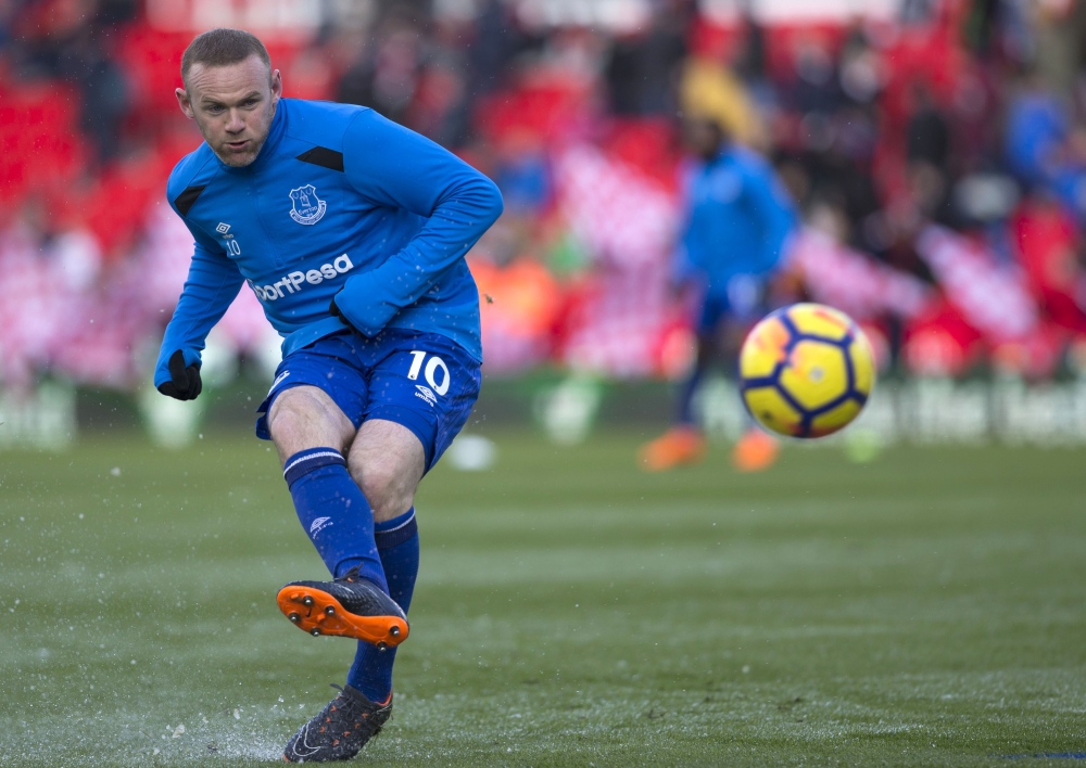 File photo shows Everton's English striker Wayne Rooney warming up before the English Premier League football match against Stoke City at the Bet365 Stadium in Stoke-on-Trent, central England. — AFP