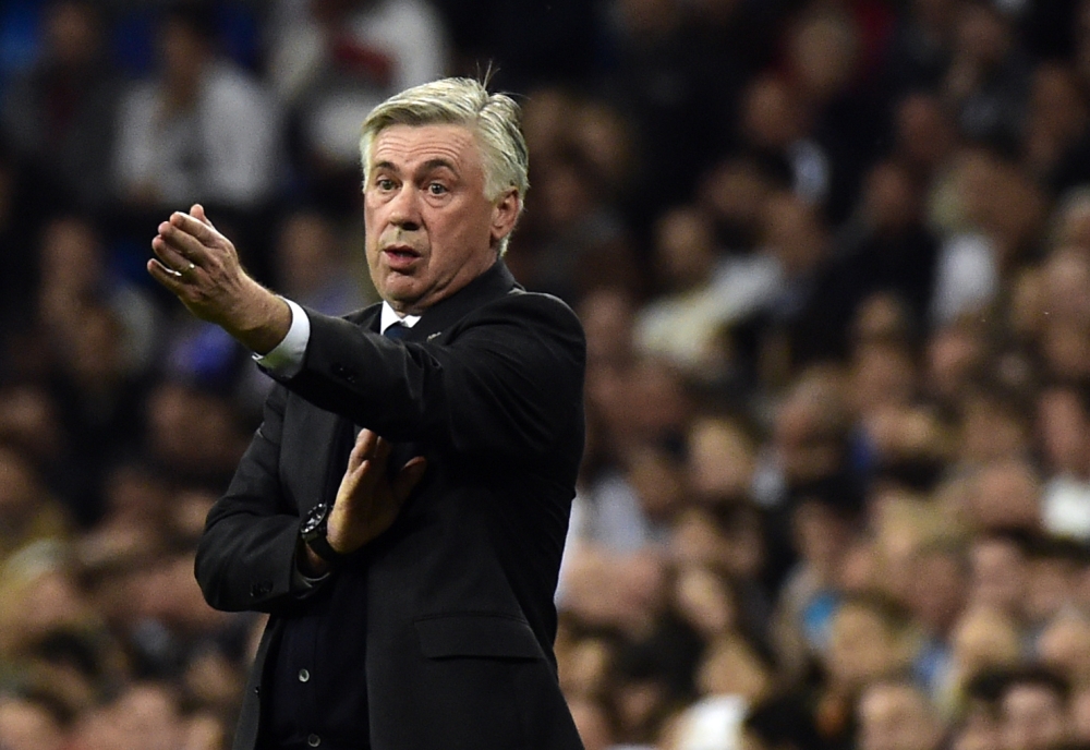 File photo taken shows then Real Madrid's Italian coach Carlo Ancelotti gesturing during the UEFA Champions League round of 16 second leg football match against FC Schalke 04 at the Santiago Bernabeu Stadium in Madrid. — AFP