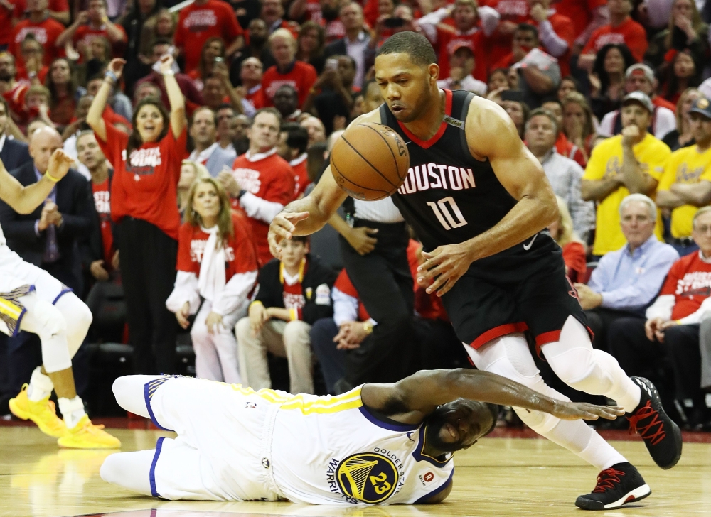 Eric Gordon No. 10 of the Houston Rockets steals from Draymond Green No. 23 of the Golden State Warriors late in the fourth quarter of Game Five of the Western Conference Finals of the 2018 NBA Playoffs at Toyota Center on Thursday in Houston, Texas.  — AFP