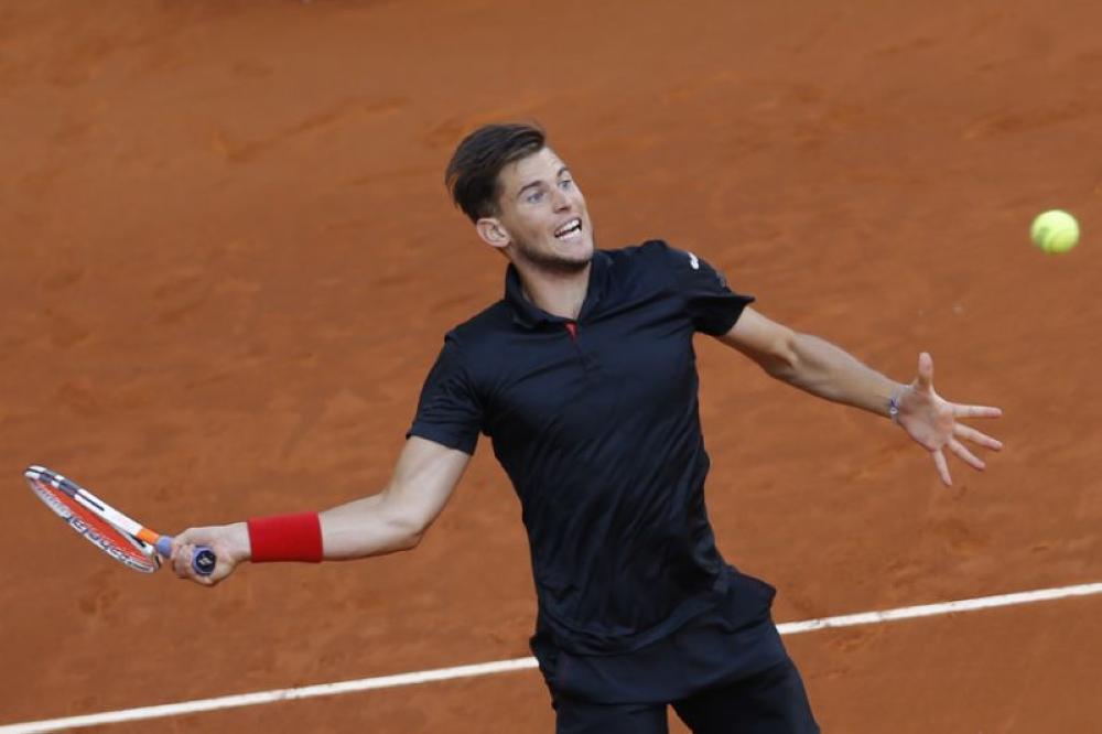 Dominic Thiem, of Austria, seen in this file photo, returns the ball to Alexander Zverev, of Germany, during the men's final of the Madrid Open Tennis tournament in Madrid, Spain. — AP