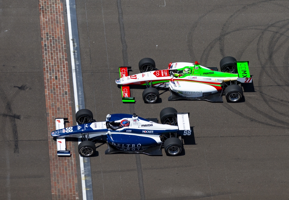 Indy Lights Series driver Colton Herta (98) beats Pato O'Ward (27) to the finish line to win the Freedom 100 at Indianapolis Motor Speedway. — Reuters