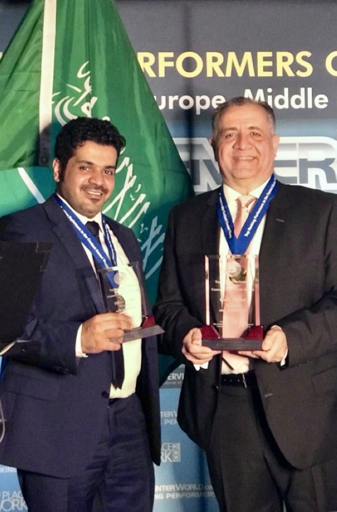 Bank Aljazira's Khalid Ramadan and Turki AlMuharib during the award ceremony in Berlin 