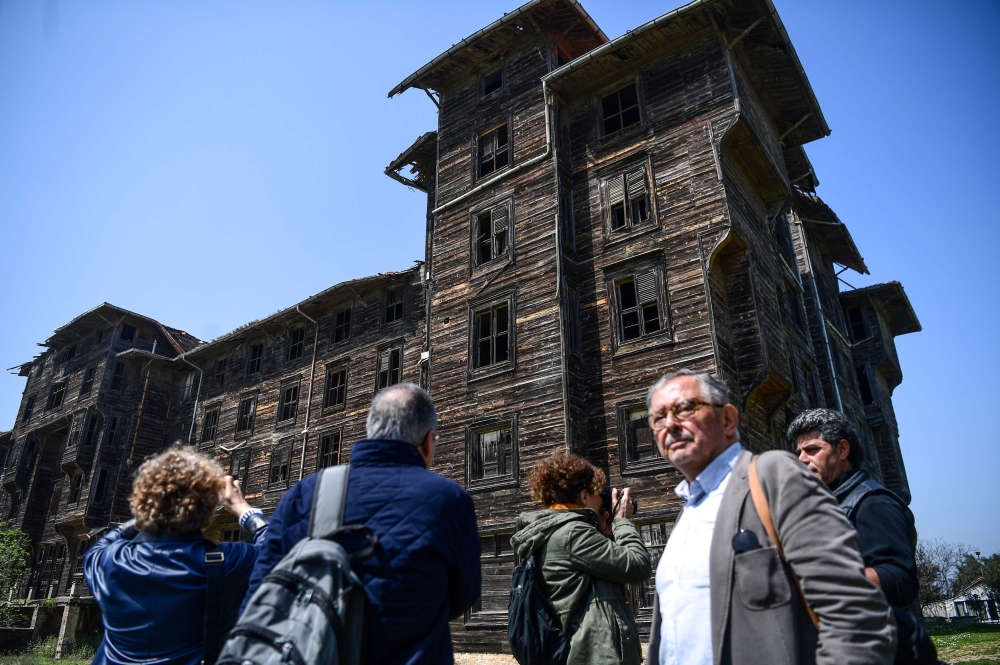 Architects look at the old Prinkipo Greek Orthodox orphanage at Princes island in Istanbul. — AFP