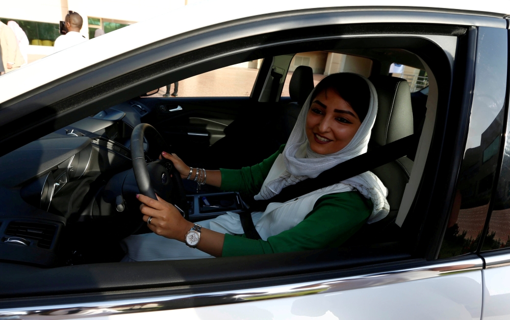 A Saudi woman sits in a car during a driving training at a university in Jeddah. — Reuters file photo
