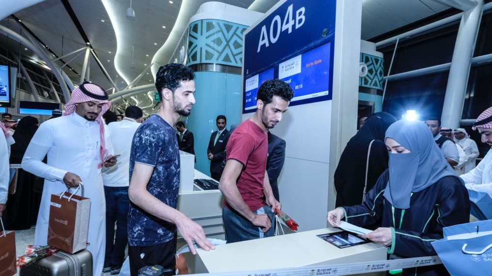 Passengers board the flight to Gurayat, the first from the new Jeddah airport on Tuesday. — Courtesy photo
