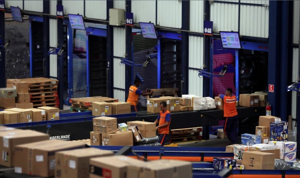 Employees work at trucking and logistics firm Braspress in Guarulhos, Brazil. — Reuters