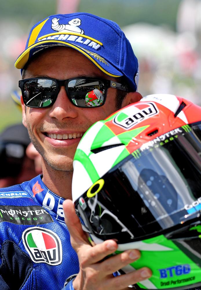Italian Movistar Yamaha rider Valentino Rossi celebrates his pole position after the Moto GP qualifying session of the Italian Grand Prix at the Mugello Circuit in Tuscany Saturday. — AFP