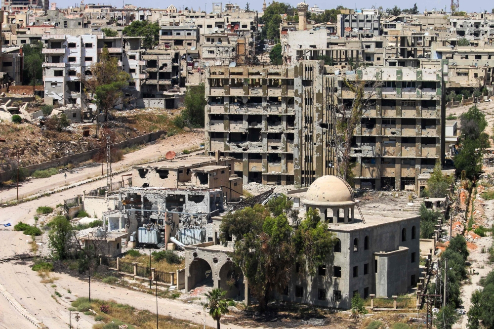 A general view of destroyed buildings in a rebel-held area in the southern Syrian city of Daraa. — AFP