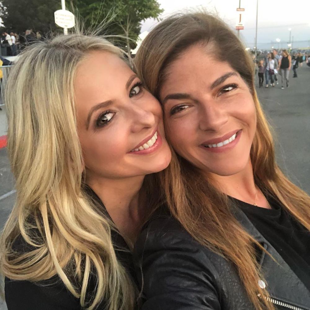Actresses Sarah Michelle Gellar, left, and Selma Blair pose for a picture during a Pink concert in Inglewood, California.