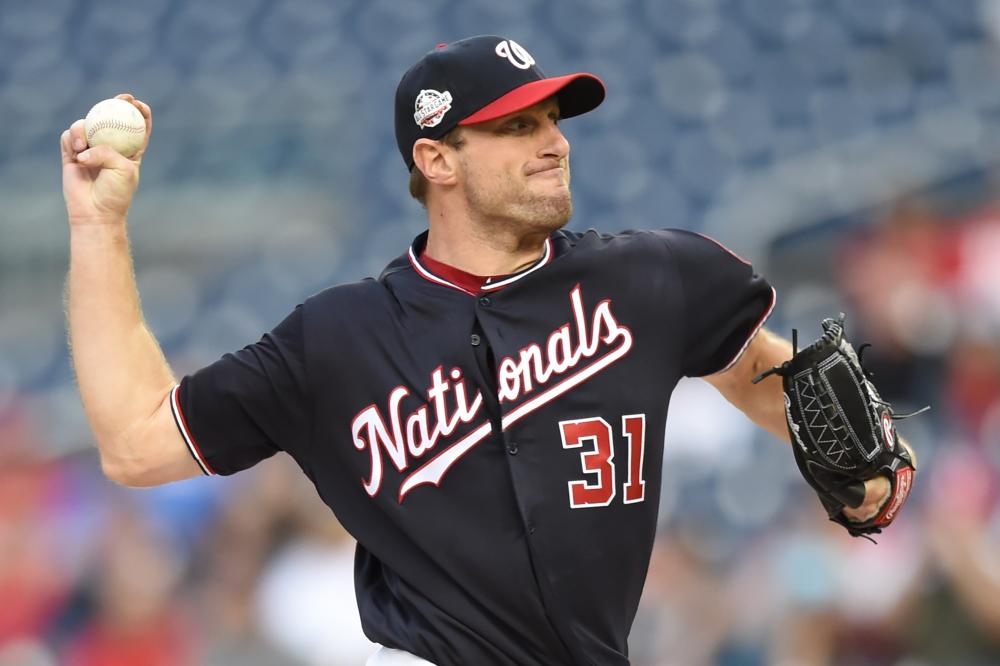 Max Scherzer of the Washington Nationals pitches in the first inning during their MLB game against the Tampa Bay Rays at Nationals Park in Washington Tuesday. — AFP