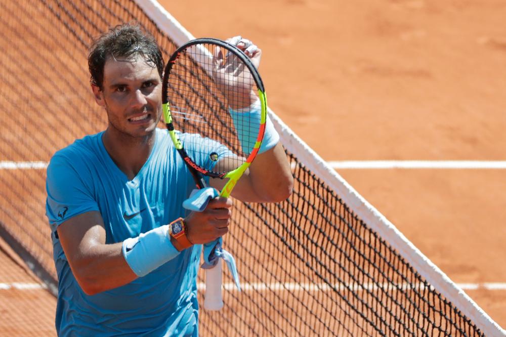 Spain’s Rafael Nadal celebrates after winning his quarterfinal against Argentina’s Diego Schwartzman at the French Open Tennis Tournament in Paris Thursday. — AFP