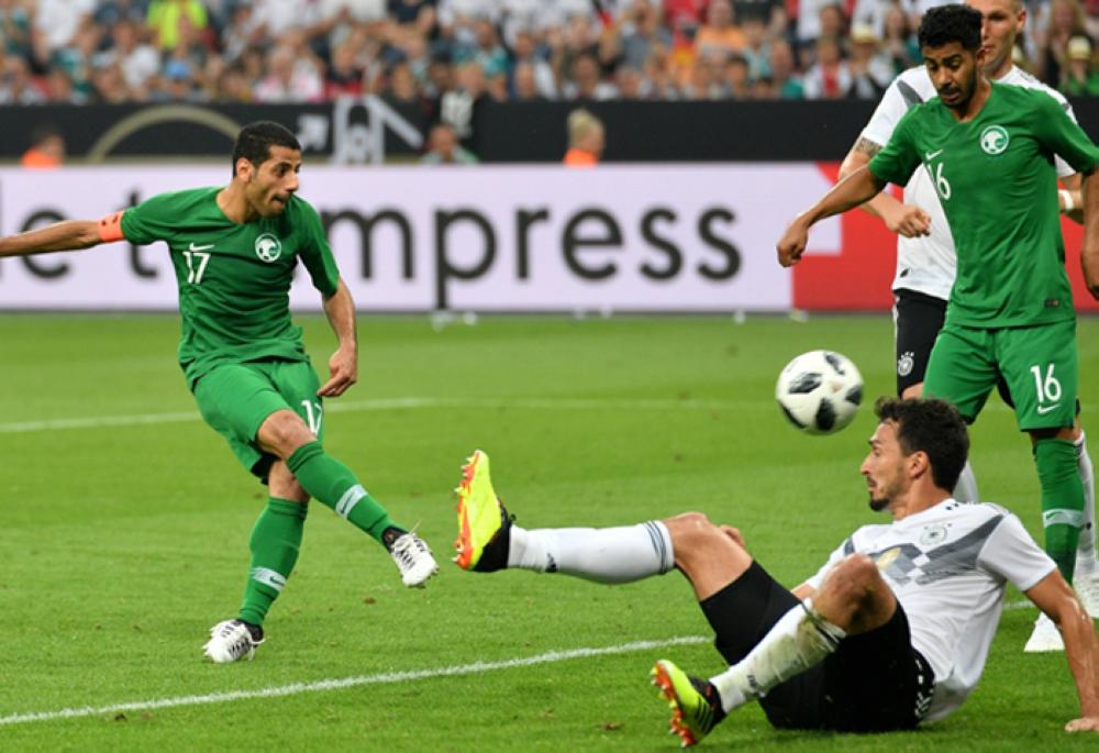 Saudi Arabia's Taiseer Aljassam (L) scoring his team first goal during the international friendly soccer match between Germany and Saudi Arabia in Leverkusen, Germany, Friday. — EPA