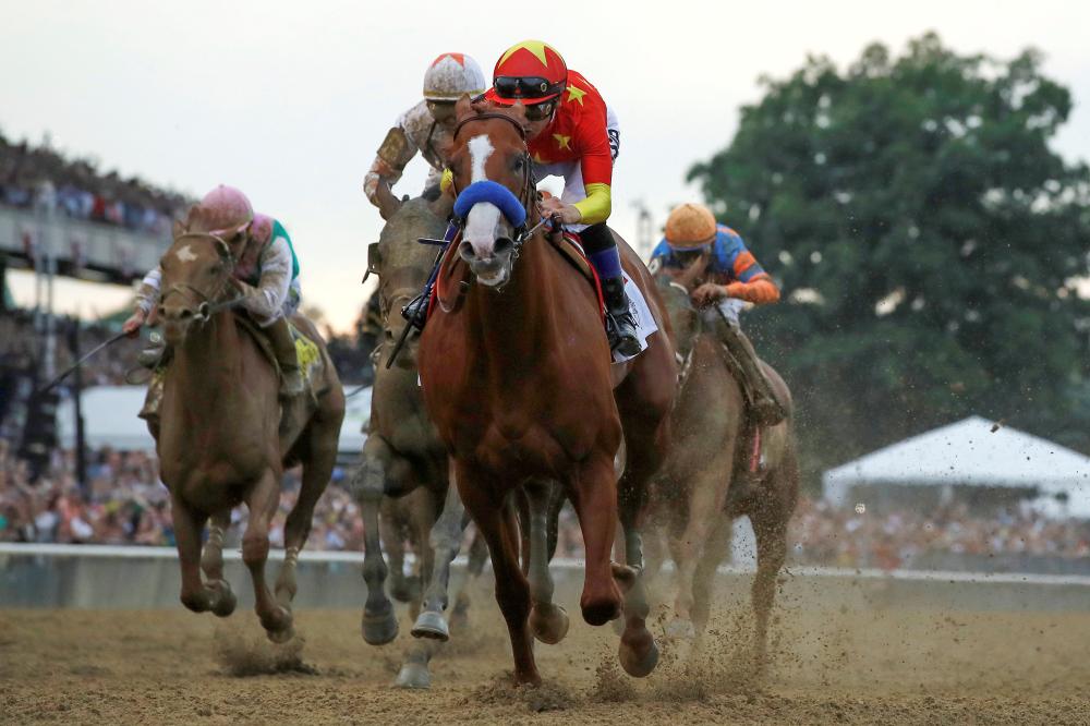 Justify, with jockey Mike Smith aboard, wins the 150th running of the Belmont Stakes, the third leg of the Triple Crown of Thoroughbred Racing at Belmont Park in Elmont, New York, Saturday. — Reuters