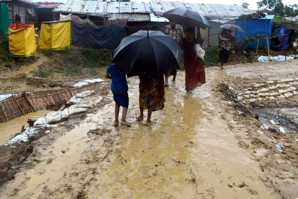 People walk after a storm at Balukhali refugee camp in Cox’s Bazar, Bangladesh on Sunday in this image obtained from social media. — Reuters