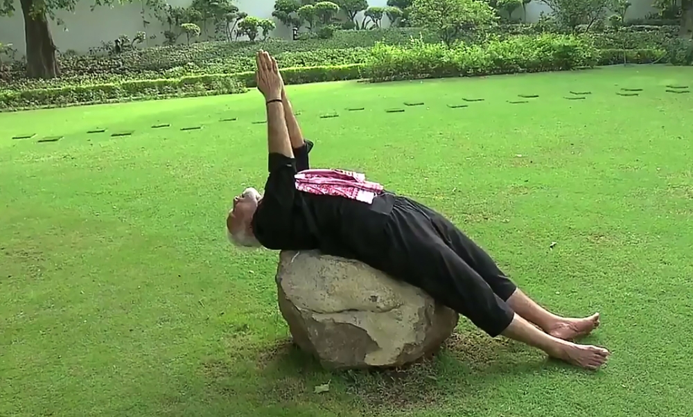 This screenshot taken from a video posted on India Prime Minister twitter handle, shows Indian Prime Minister Narendra Modi performing Yoga following a fitness challenge in New Delhi on Wednesday. — AFP