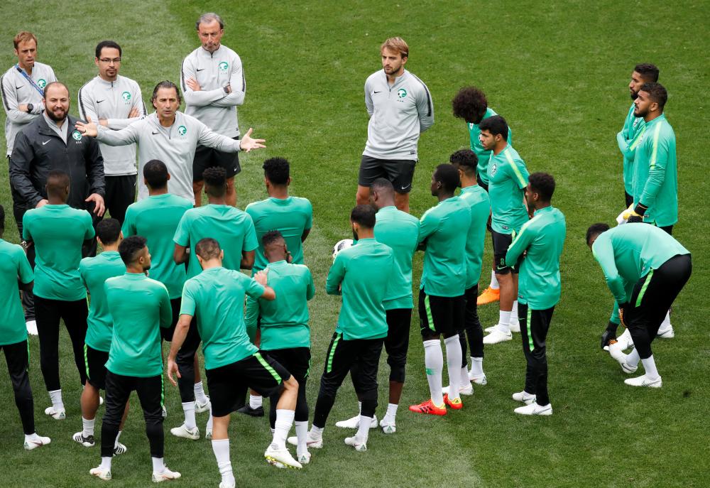 Saudi Arabia coach Juan Antonio Pizzi speaks with players during training at Luzhniki Stadium, Moscow, Wednesday. — Reuters