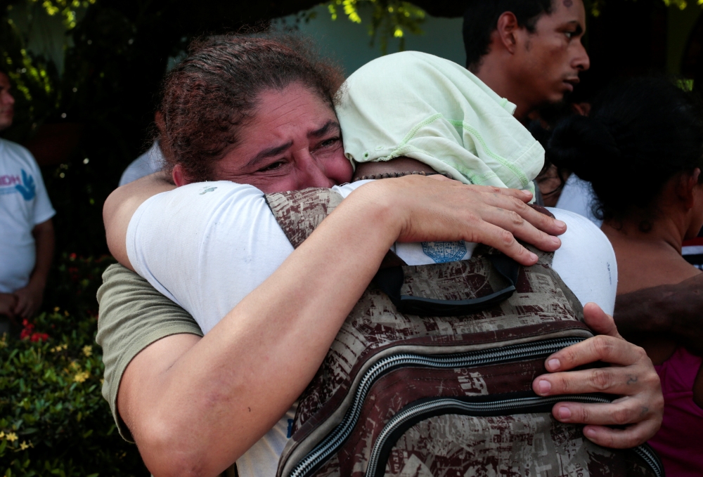 A woman embraces her son who was released by police after being arrested for participating in a protest against Nicaragua President Daniel Ortega’s government in Managua, Nicaragua, on Wednesday. — Reuters