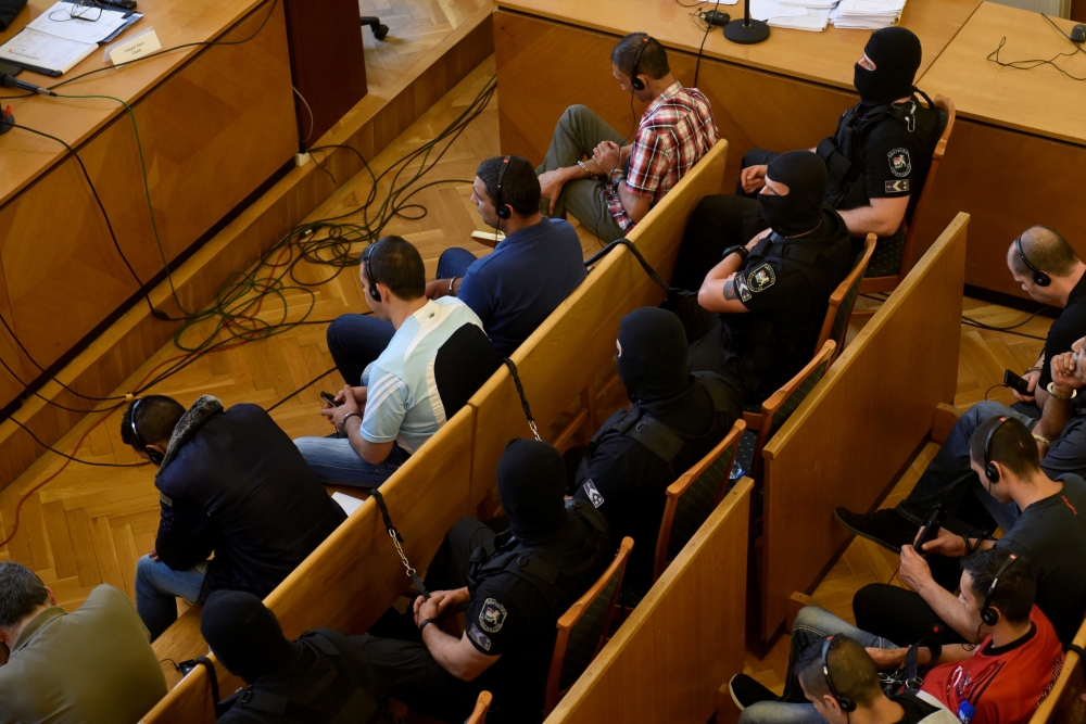 People-smugglers found guilty in the case of 71 migrants who suffocated to death in a truck in 2015, listen to the judge as he delivers the verdict and reasoning in a Hungarian court in Kecskemet, Hungary, on Thursday. — Reuters