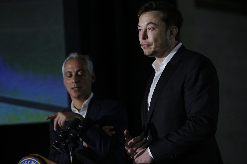 Chicago Mayor Rahm Emanuel and engineer and tech entrepreneur Elon Musk of The Boring Company talk about constructing a high speed transit tunnel at Block 37 during a news conference on Thursday in Chicago, Illinois. Musk said he could create a 16-passenger vehicle to operate on a high-speed rail system that could get travelers to and from downtown Chicago and O'hare International Airport under twenty minutes, at speeds of over 100 miles per hour. — AFP
