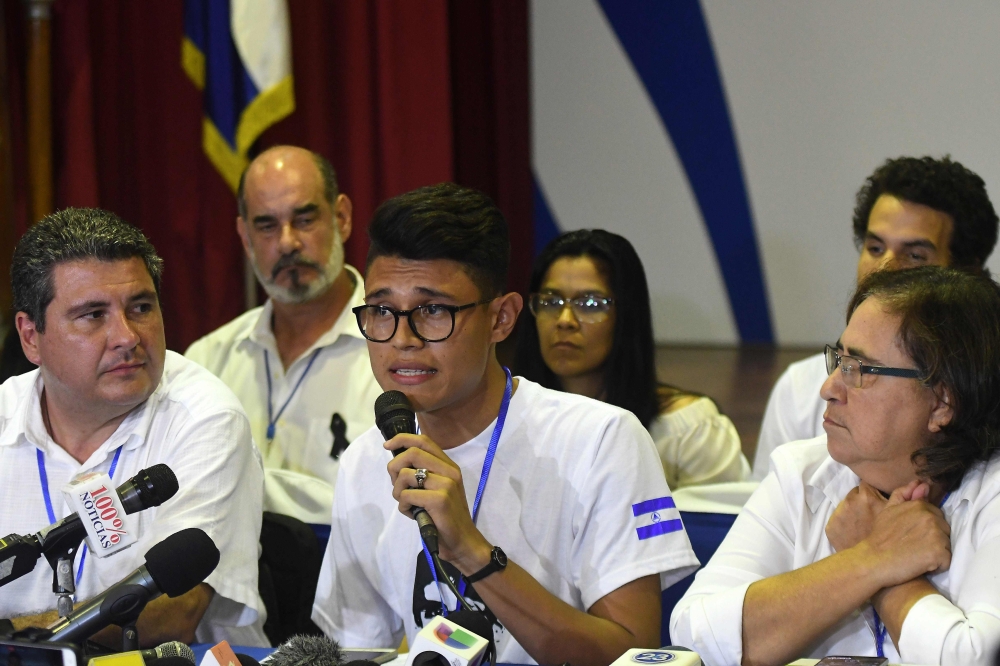 University students leader Lesther Aleman, center, attends a conference at the end of the so-called “national dialogue” talks among government’s representatives, Nicaragua’s Roman Catholic bishops in an attempt to stifle anti-government unrest in Managua on Friday. — AFP