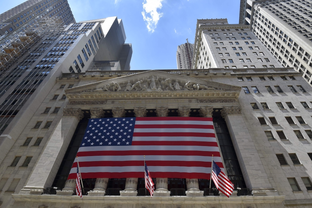 File photo shows the New York Stock exchange building in Wall street, downtown Manhattan in New York City.  Wall Street stocks retreated Friday as tit-for-tat tariff announcements by the United States and China ignited a trade war that could spread. — AFP 