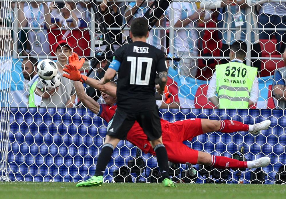 Iceland's goalkeeper Hannes Por Halldorsson saves a penalty taken by Argentina's Lionel Messi during their World Cup match at Spartak Stadium in Moscow Saturday. — Reuters