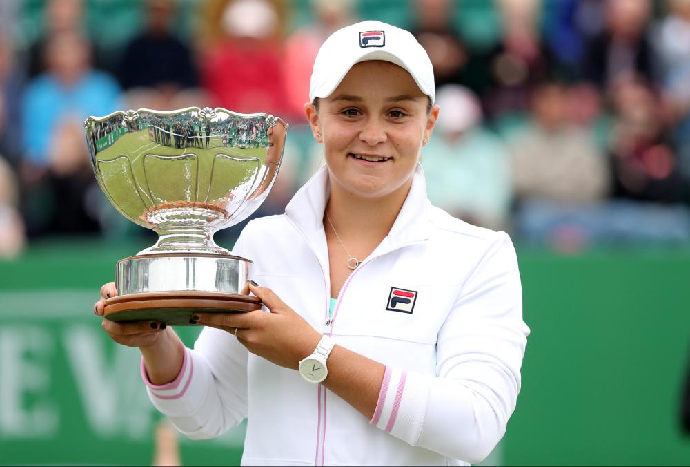 Australia's Ashleigh Barty holds the trophy after beating Johanna Konta of Great Britain in the final of the WTA International Tennis Tournament in Nottingham Sunday. — Reuters