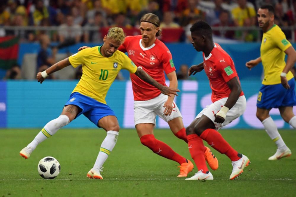 Brazil's forward Neymar (L) controls the ball during the Russia 2018 World Cup Group E football match between Brazil and Switzerland at the Rostov Arena in Rostov-On-Don on Sunday. — AFP