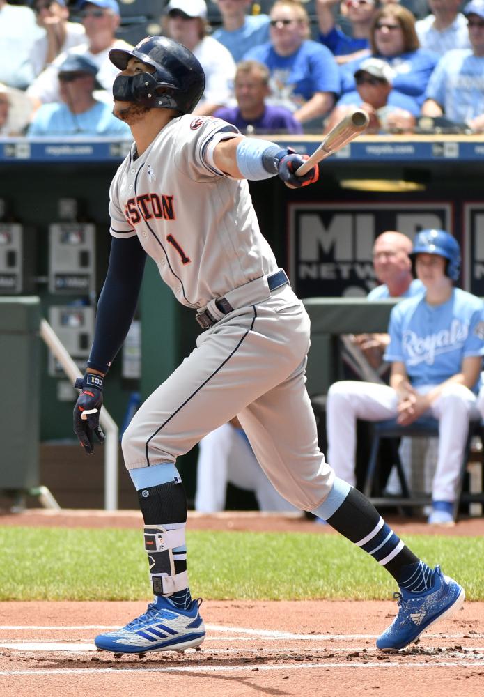 Carlos Correa of the Houston Astros hits an RBI single in the first inning against the Kansas City Royals at Kauffman Stadium in Kansas City Sunday. — AFP