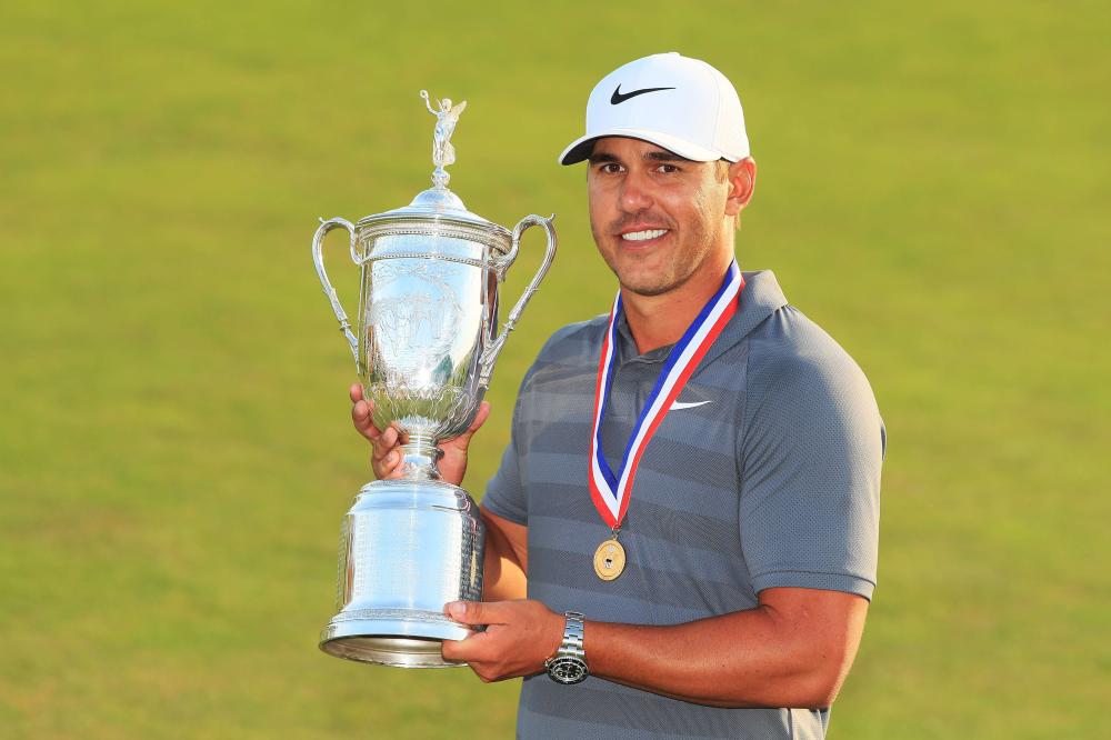Brooks Koepka of the United States celebrates with the US Open Championship trophy after winning the 2018 US Open at Shinnecock Hills Golf Club in Southampton, New York, Sunday. — AFP