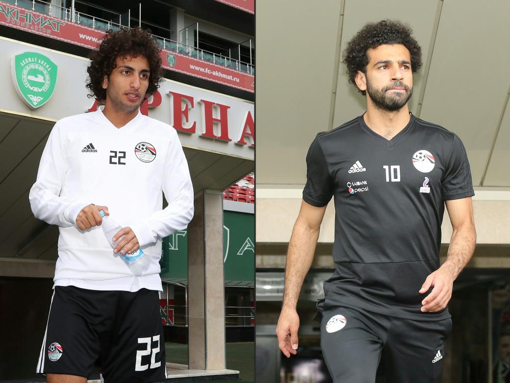 This combination of pictures show Egypt's midfielder Amr Warda (L) attending a training session during the Russia 2018 World Cup at the Akhmat Arena Stadium in Grozny and Mohamed Salah arriving for a training session at the Akhmat Arena stadium in Grozny Sunday. — AFP