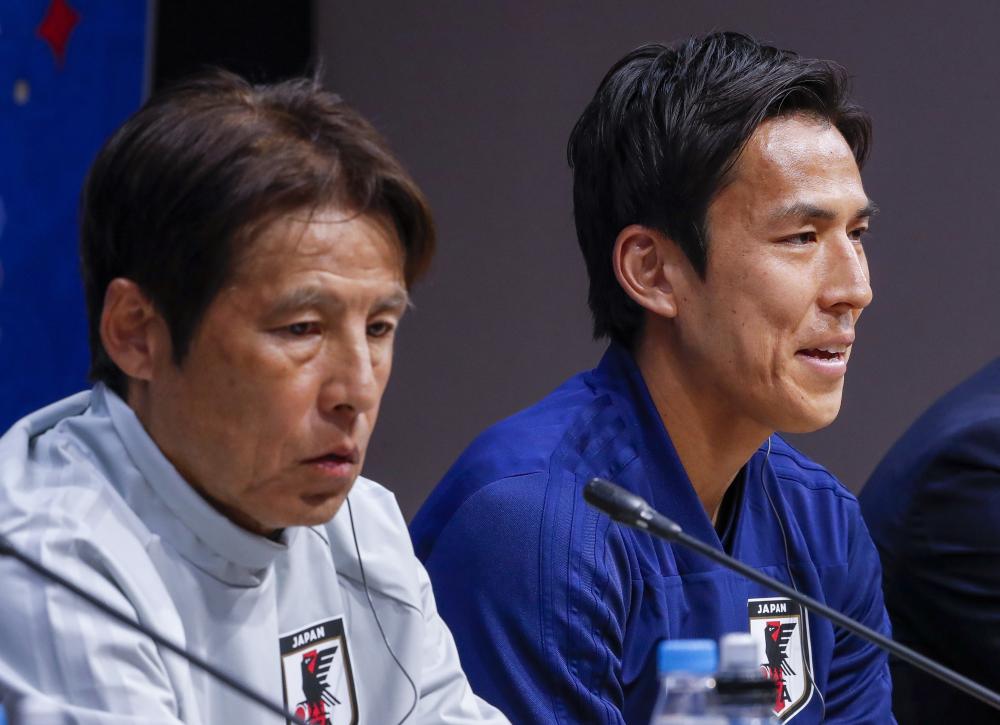 Japan coach Akira Nishino (L) and midfielder Makoto Hasebe (R) participate in a press conference at Mordovia Arena in Saransk, Russia, Monday. — EPA 