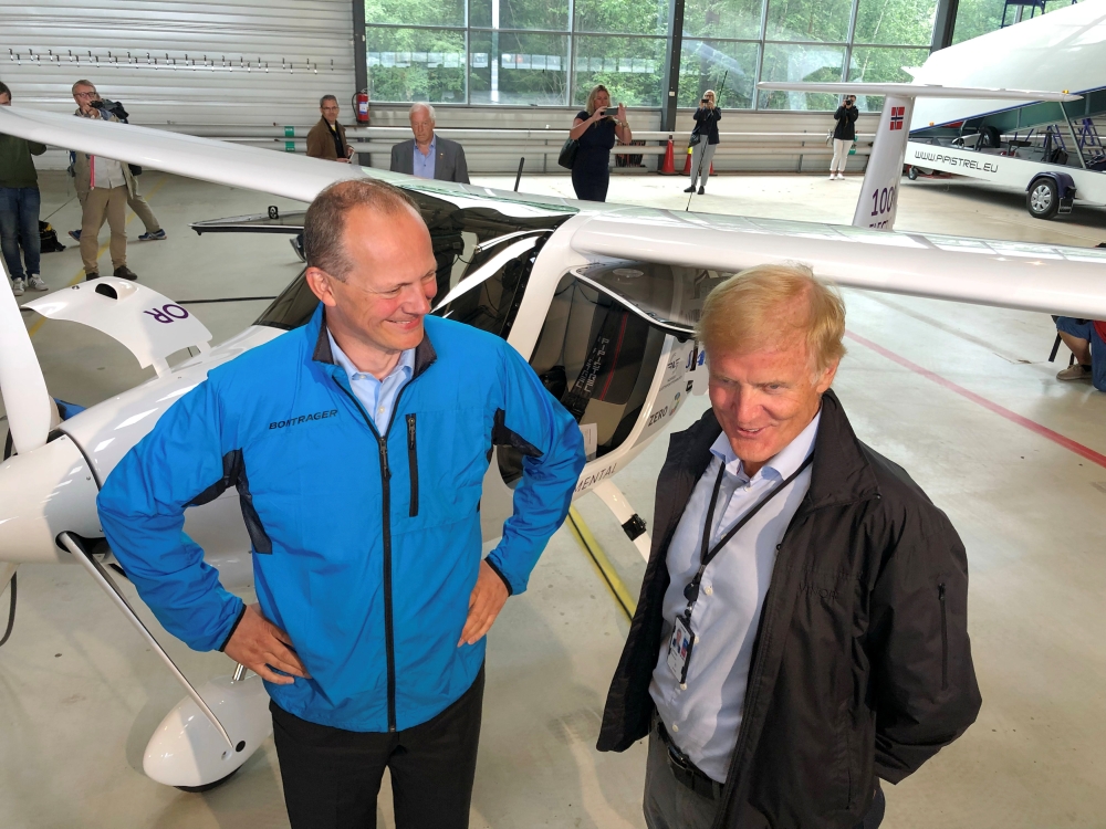 People stand around a two-seat electric plane made by Slovenian company Pipistrel after a test flight at Oslo Airport, Norway, on Monday. — Reuters