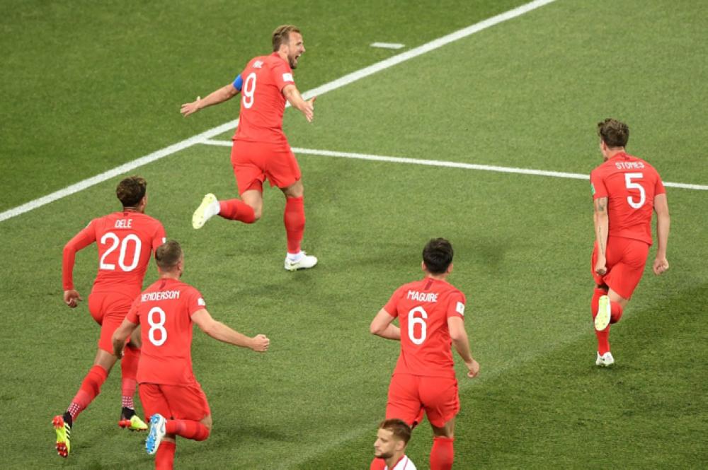 England's forward Harry Kane (up) celebrates after scoring his first goal during the Russia 2018 World Cup Group G football match between Tunisia and England at the Volgograd Arena in Volgograd on Monday. — AFP
