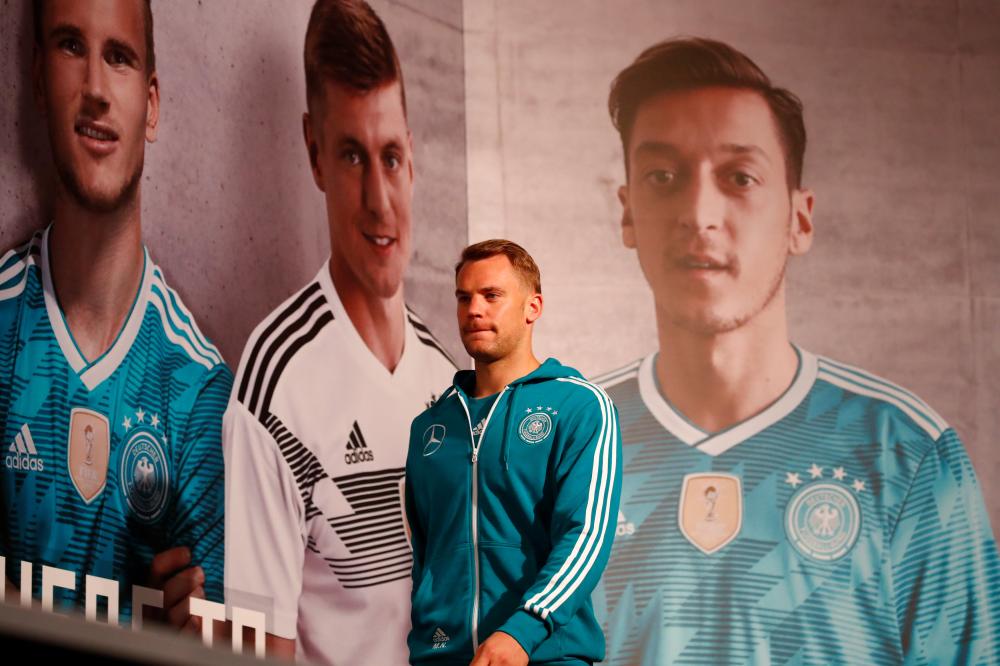 Germany’s captain and goalkeeper Manuel Neuer arrives for the press conference Tuesday. — Reuters