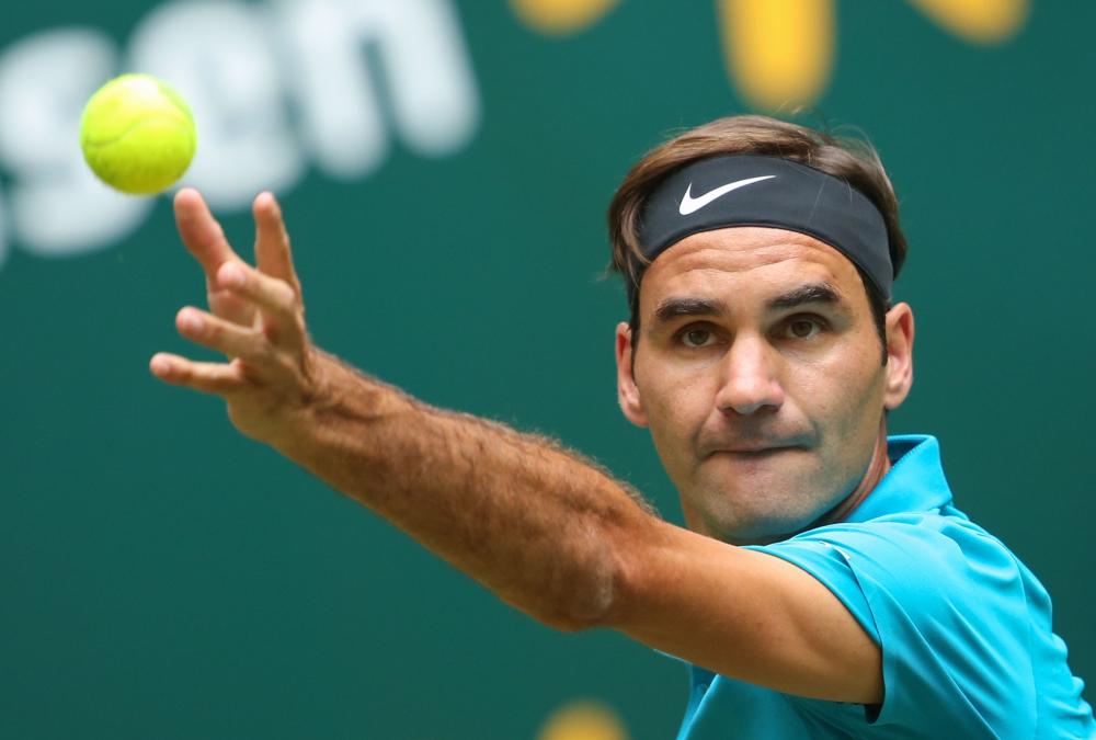 Switzerland's Roger Federer eyes the ball during his match against Slovenia's Aljaž Bedene at the ATP Gerry Weber Open Tennis Tournament in Halle, western Germany, Tuesday. — AFP