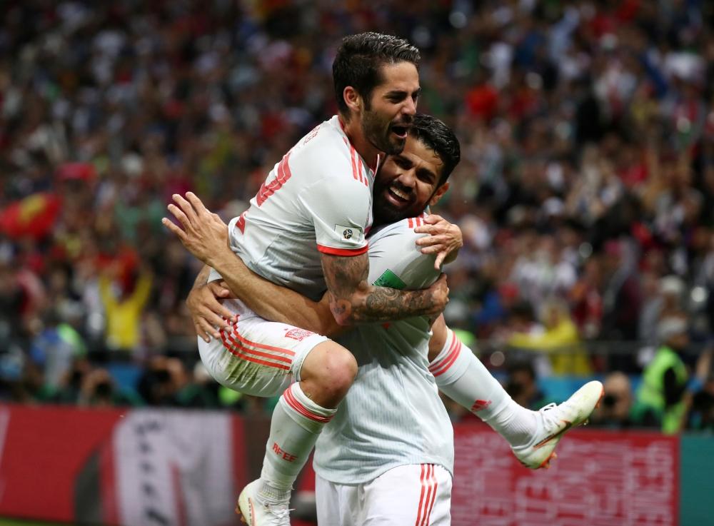 Spain's Diego Costa celebrates scoring their first goal with Isco — Reuters