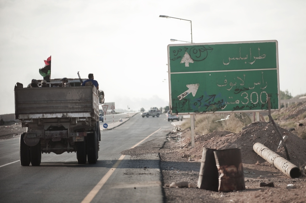 In this 2011 photo, a supplies truck drives through the main road in the oil rich town of Ras Lanuf, some 150 km east of Sirte. 
