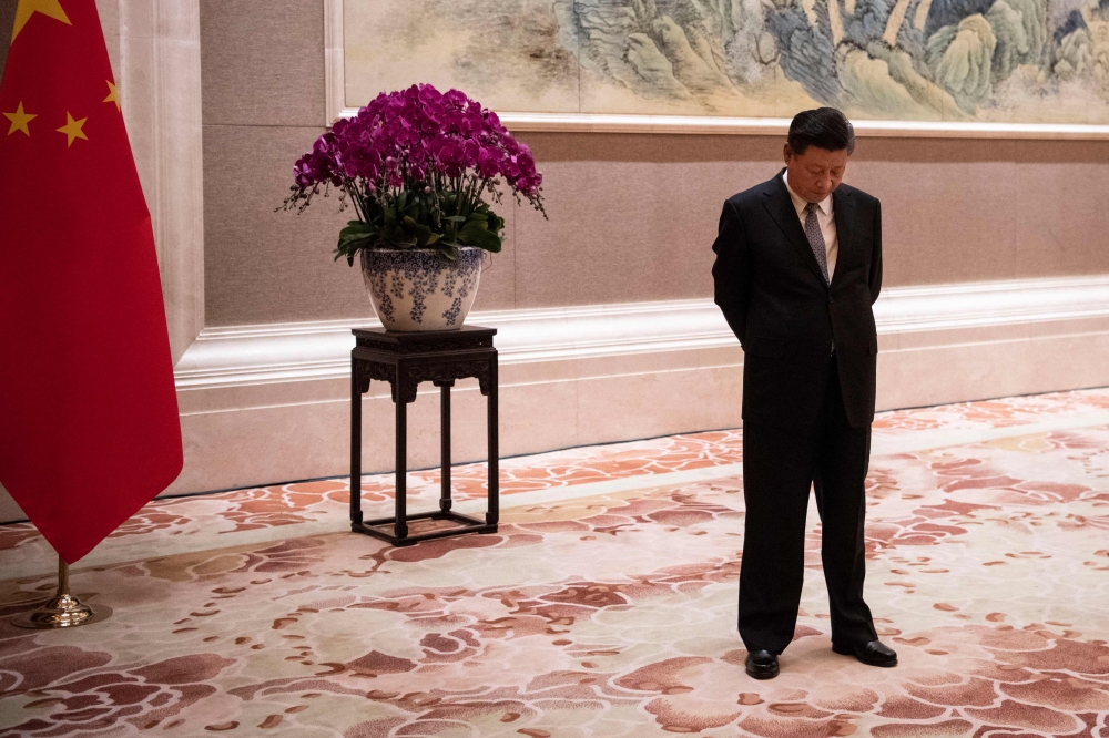 Chinese President Xi Jinping waits for the arrival of Papua New Guinea’s Prime Minister Peter O’Neill prior to their meeting at the Diaoyutai State Guesthouse in Beijing on Thursday. — AFP