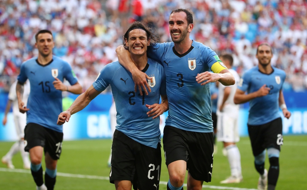 Uruguay's Edinson Cavani celebrates scoring their third goal with Diego Godin during the World Cup Group A match at the Samara Arena, Samara, Russia  — Reuters